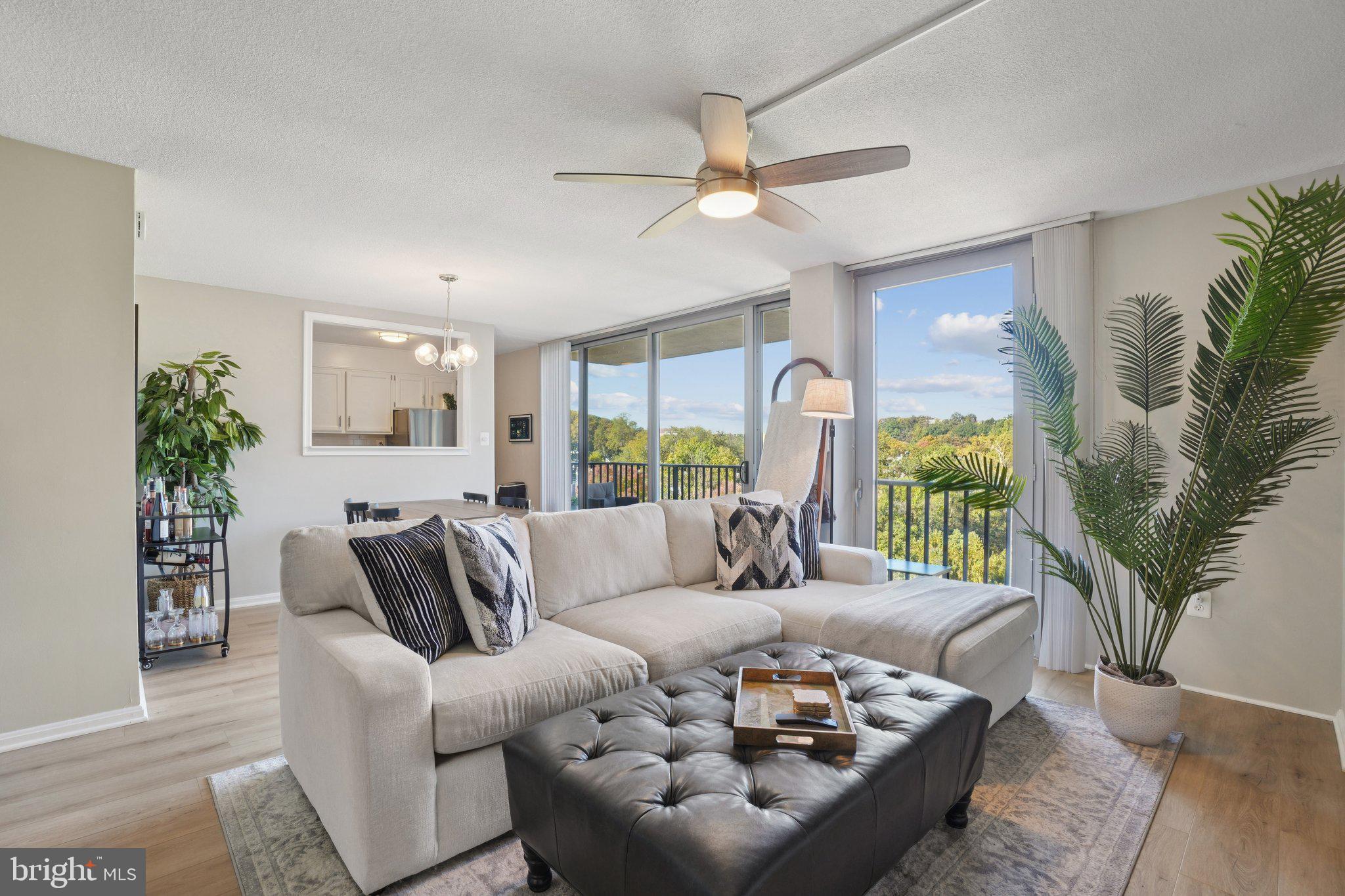 4600 South Four Mile Run Drive, Unit 842 Arlington, VA 22204 - Photo 1 of 24 a living room with furniture and a large window