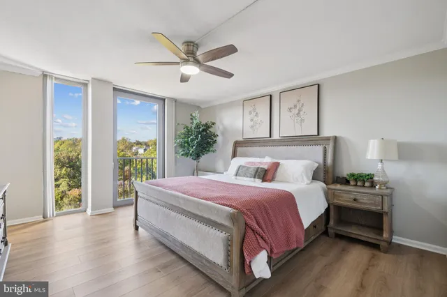 a bedroom with a large bed and a large window