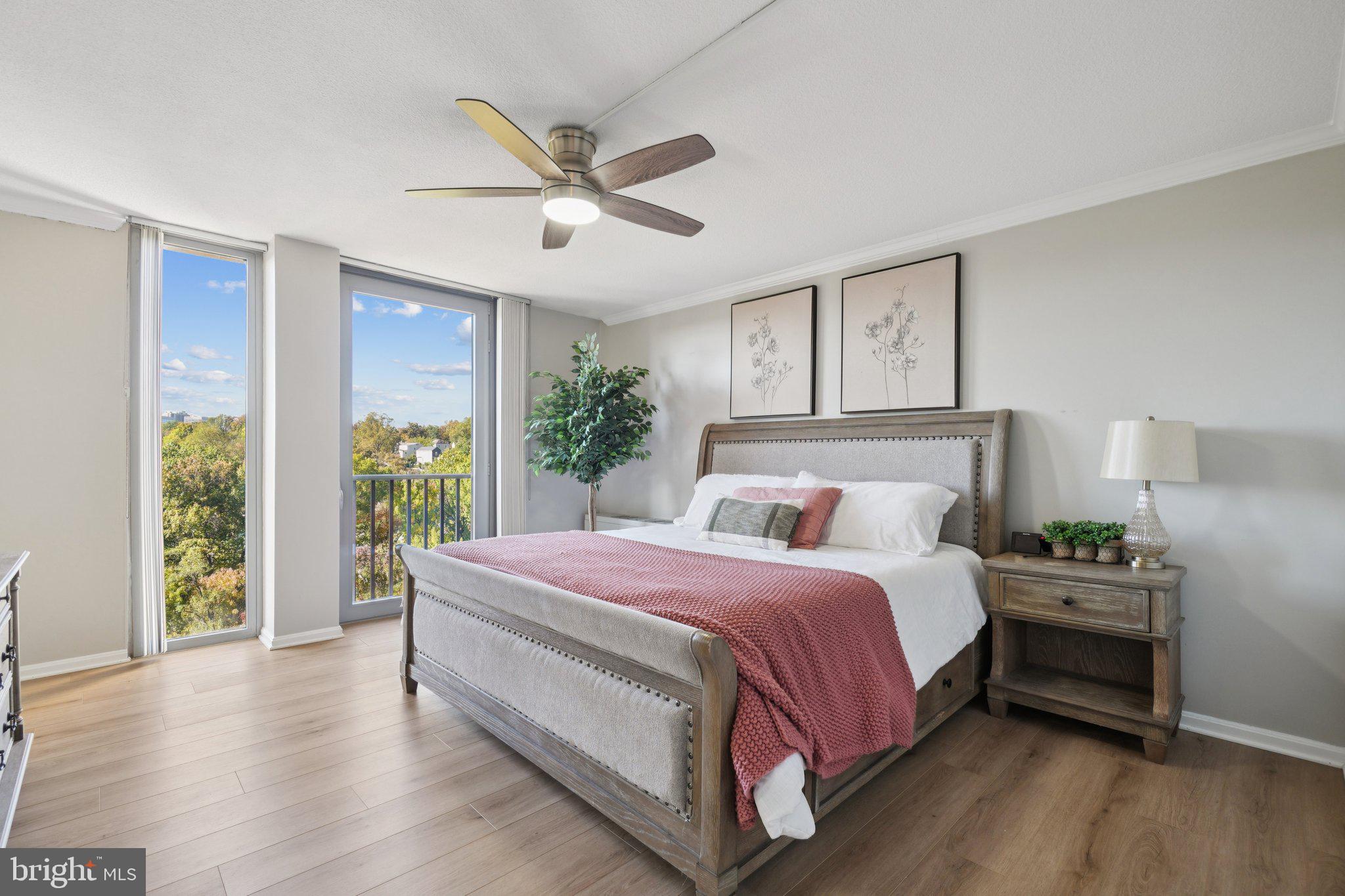 4600 South Four Mile Run Drive, Unit 842 Arlington, VA 22204 - Photo 12 of 24 a bedroom with a large bed and a large window
