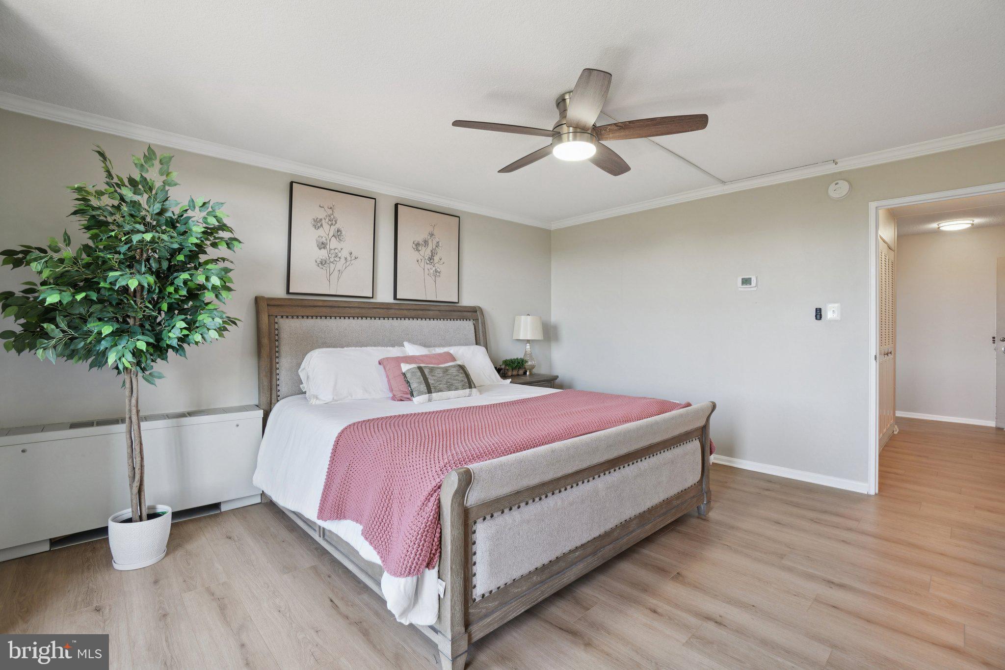4600 South Four Mile Run Drive, Unit 842 Arlington, VA 22204 - Photo 14 of 24 a bed room with a bed and a potted plant