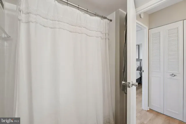 a bathroom with a shower and a tub