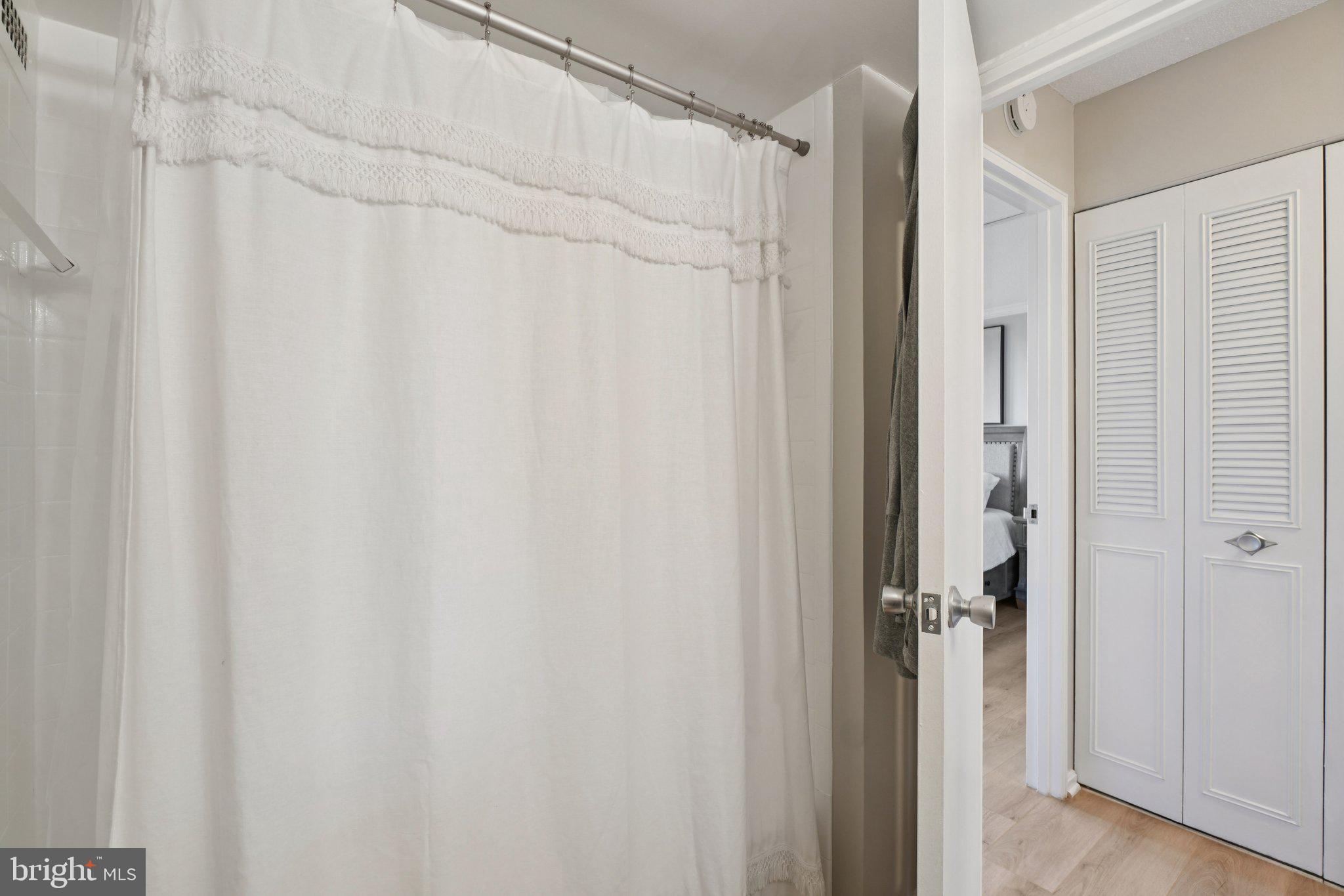 4600 South Four Mile Run Drive, Unit 842 Arlington, VA 22204 - Photo 18 of 24 a bathroom with a shower and a tub