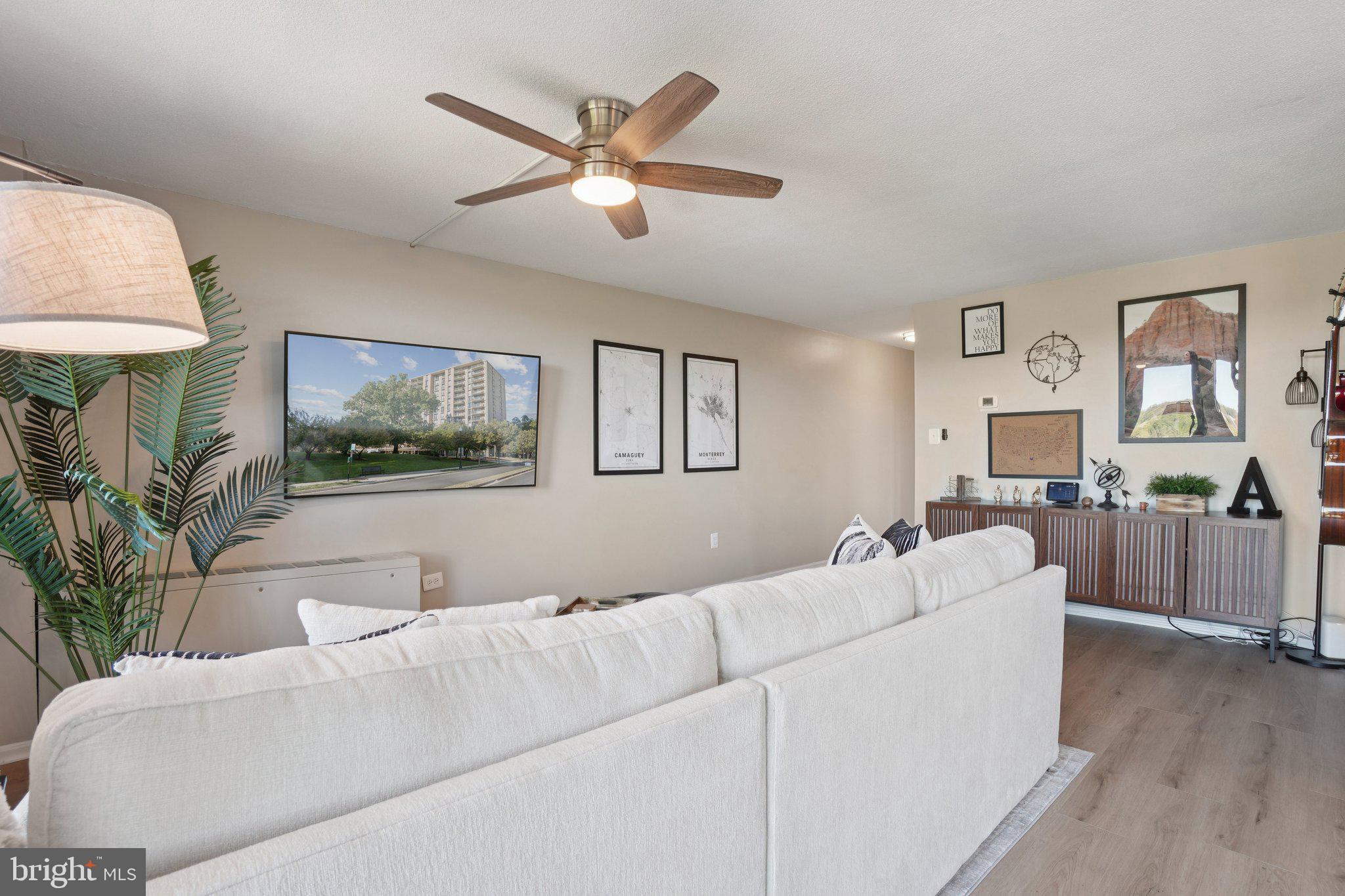 4600 South Four Mile Run Drive, Unit 842 Arlington, VA 22204 - Photo 3 of 24 a living room with furniture and a large window
