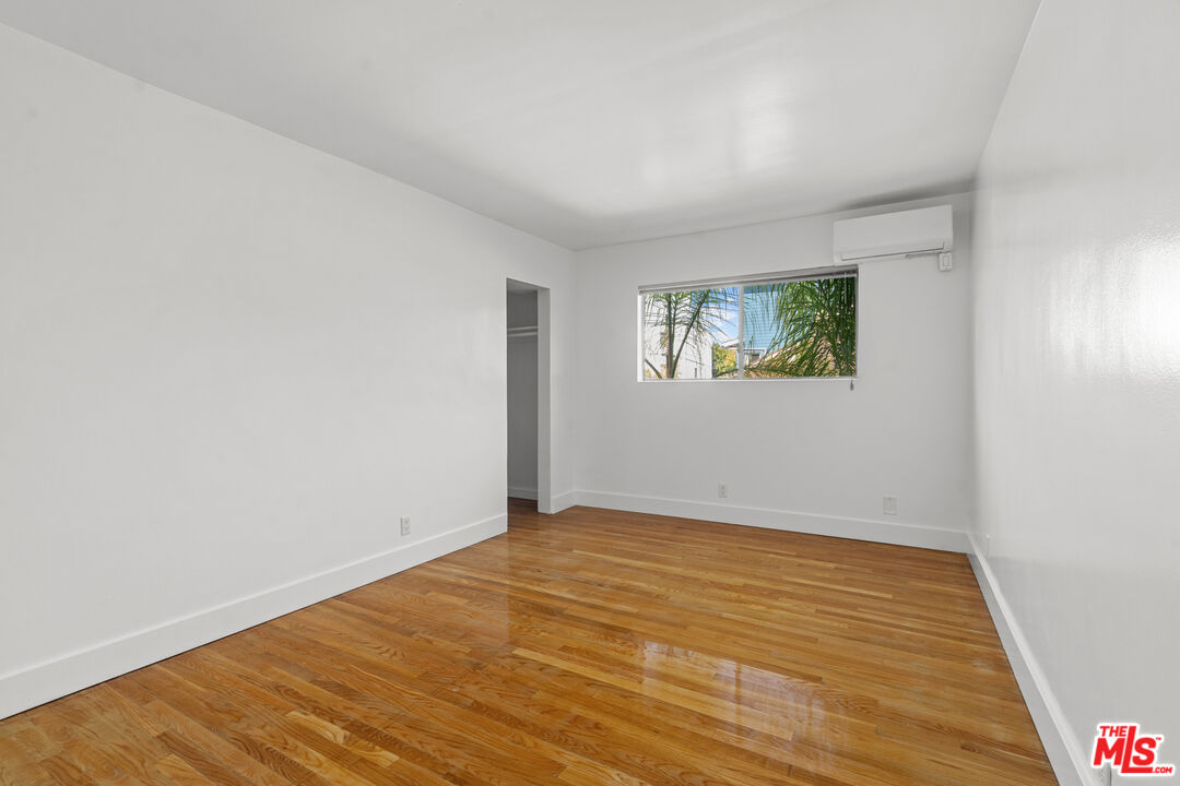 511 Rialto Avenue, Unit 4 Venice, CA 90291 - Photo 11 of 17 an empty room with wooden floor and window
