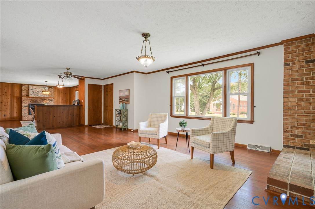 Spacious living area showcasing rich wood-finish f