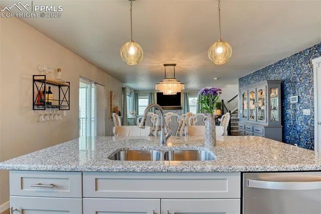 a view of a kitchen counter space a sink and cabinets