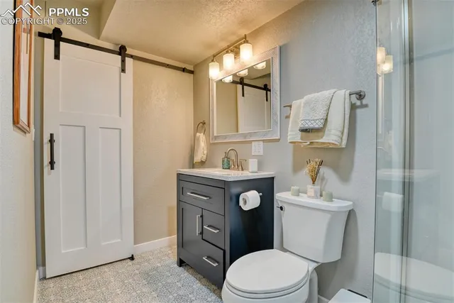 a white toilet sitting next to a bathroom sink