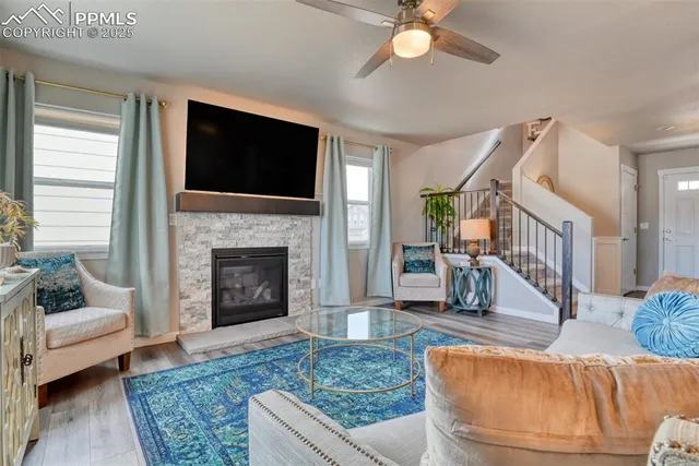 a living room with furniture and a fireplace