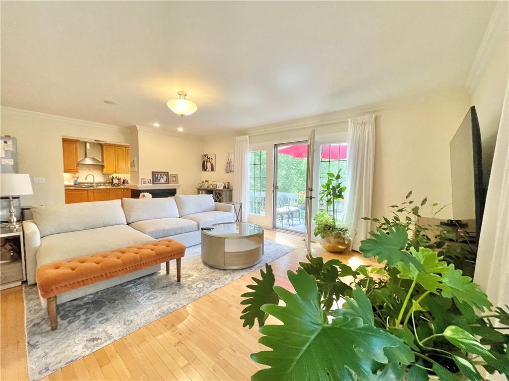 518 Farndale Road Pittsburgh, PA 15215 - Photo 16 of 37 a living room with furniture plant and a large window