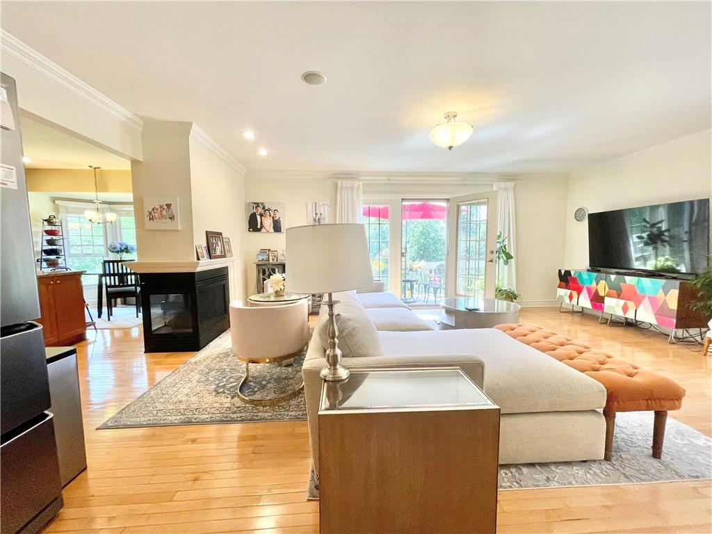 518 Farndale Road Pittsburgh, PA 15215 - Photo 20 of 37 a dining hall with stainless steel appliances kitchen island granite countertop a dining table and chairs with wooden floor