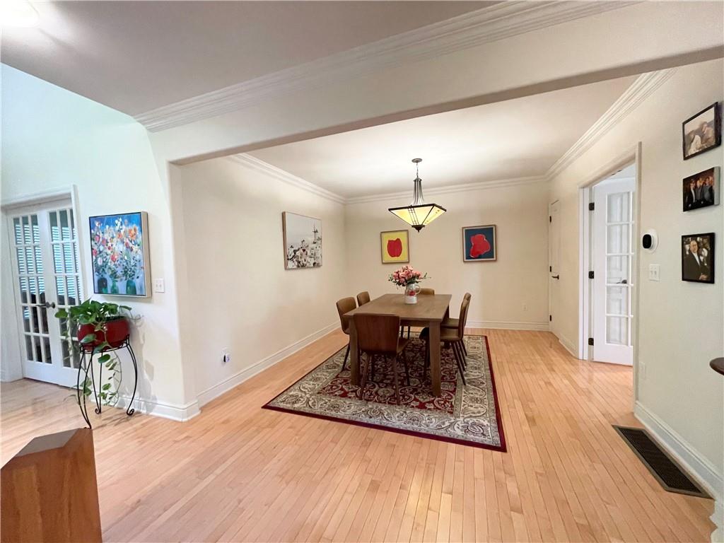 518 Farndale Road Pittsburgh, PA 15215 - Photo 9 of 37 a dining room with furniture and wooden floor