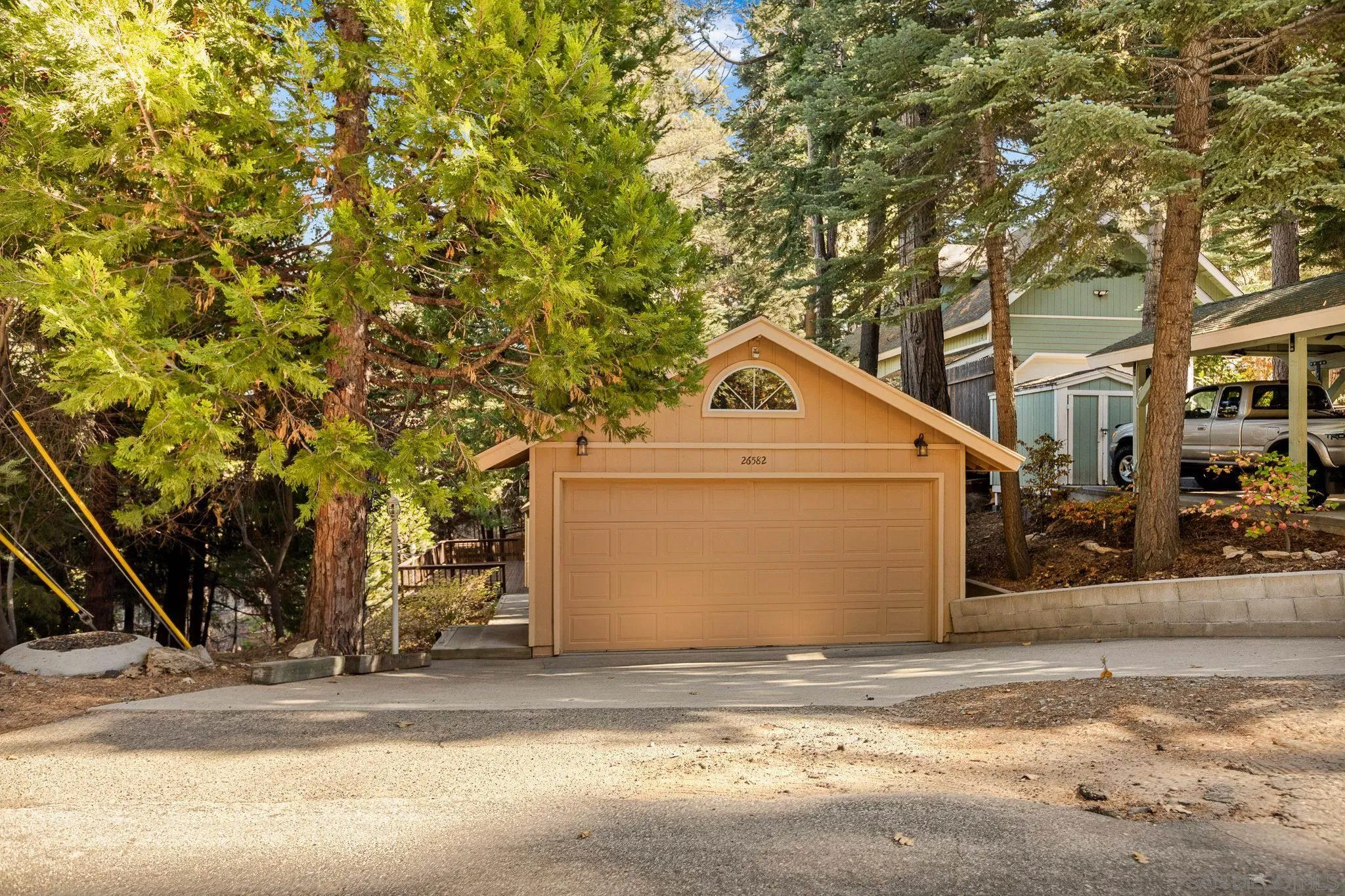 a view of a house with a yard and garage