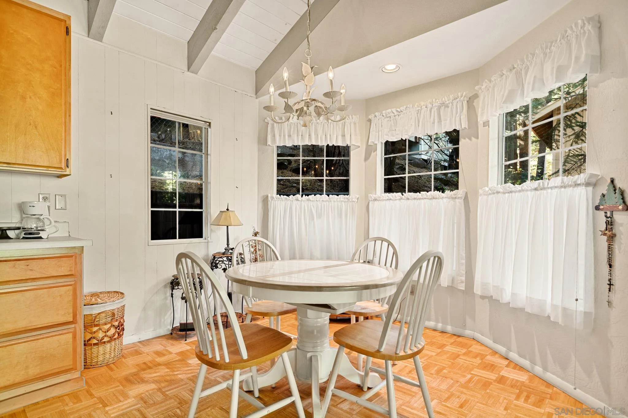 26582 Lake Forest Drive Twin Peaks, CA 92391 - Photo 11 of 25 a view of a dining room with furniture and chandelier