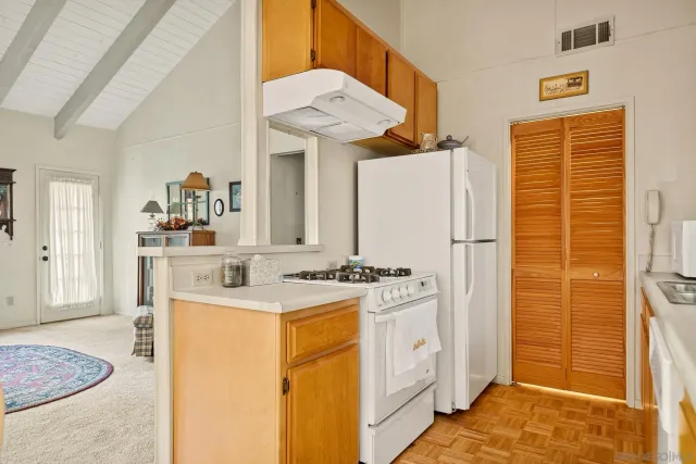 a view of a kitchen with appliances and cabinets