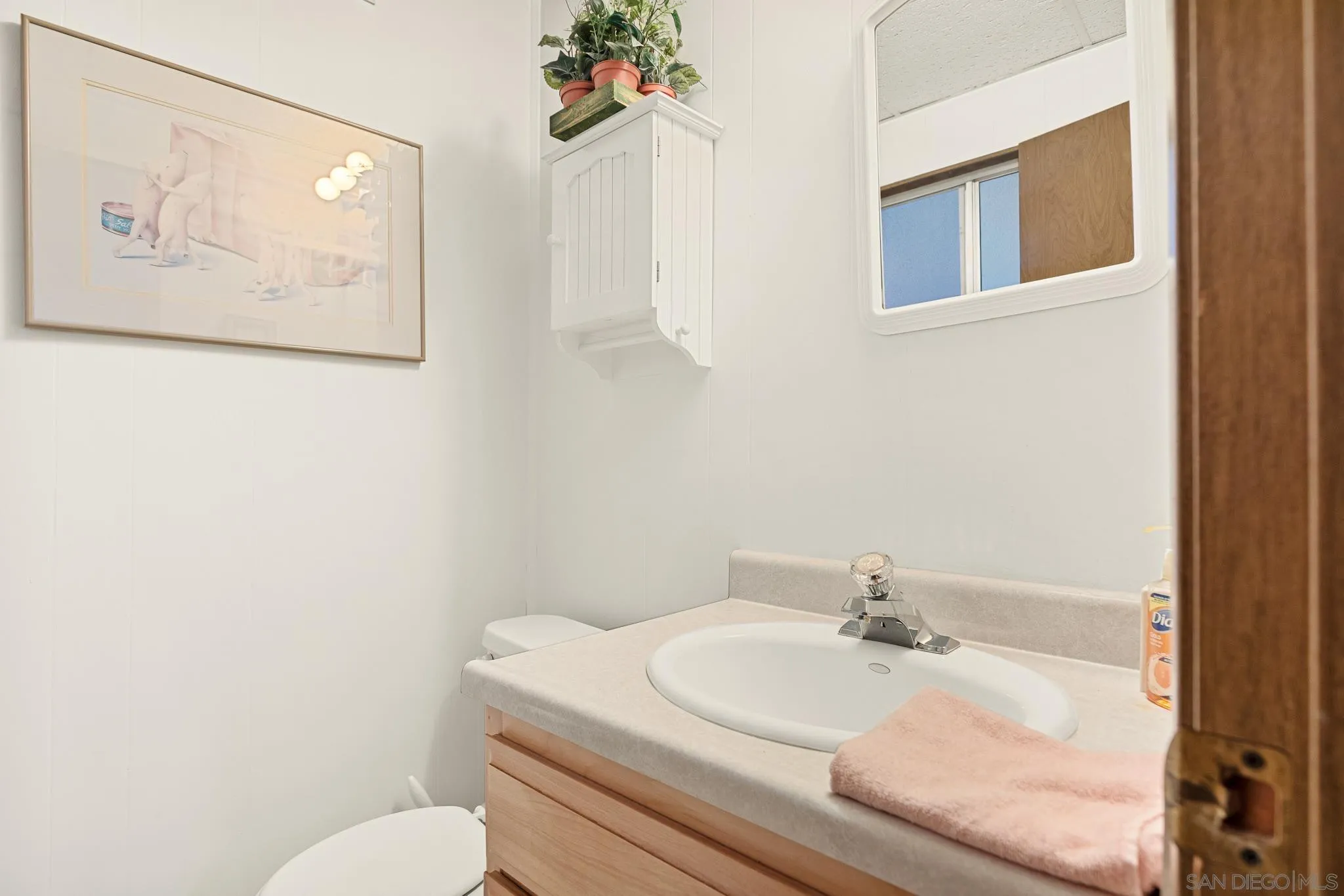 26582 Lake Forest Drive Twin Peaks, CA 92391 - Photo 21 of 25 a bathroom with a toilet and a sink