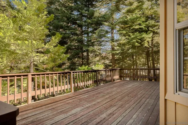 a view of balcony with wooden floor