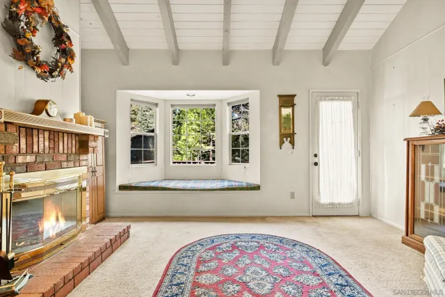 a bedroom with a bed and a window with outer view