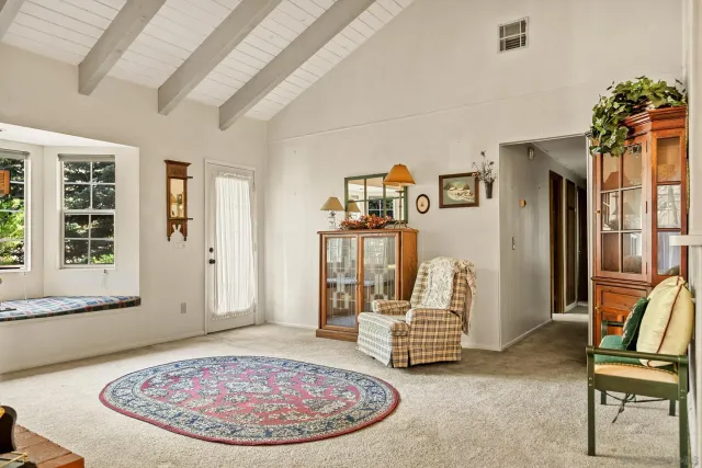 a view of a livingroom with furniture and a staircase