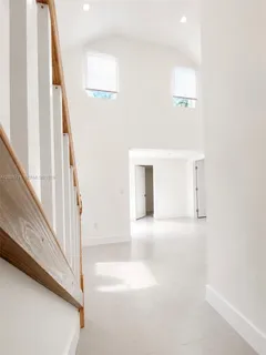 a view of a hallway with staircase