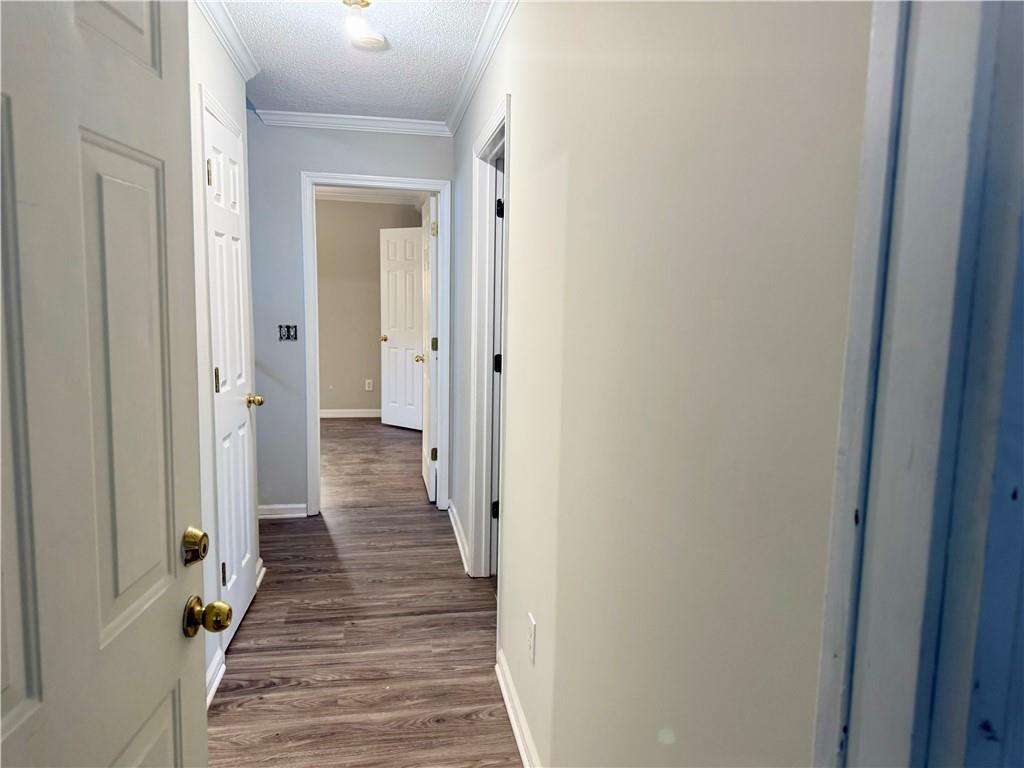 3162 Mosely Chase Drive Southwest Austell, GA 30106 - Photo 5 of 9 a view of a hallway with wooden floor and a bathroom