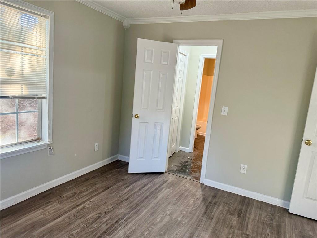 3162 Mosely Chase Drive Southwest Austell, GA 30106 - Photo 6 of 9 an empty room with wooden floor and windows
