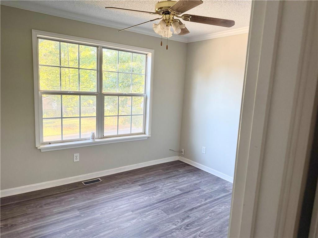 3162 Mosely Chase Drive Southwest Austell, GA 30106 - Photo 9 of 9 a view of an empty room with wooden floor and a window