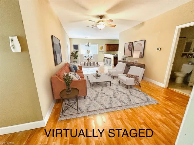 a living room with furniture and a rug