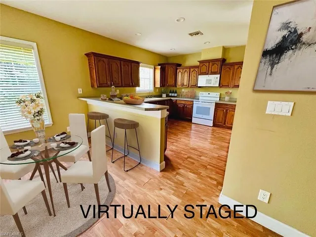 a kitchen with a sink appliances and cabinets