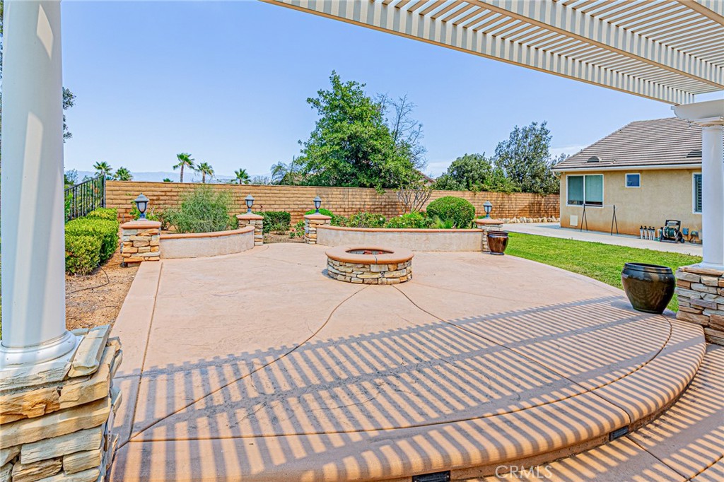 4088 Shady Ridge Circle Corona, CA 92881 - Photo 12 of 47 a view of a swimming pool with a patio