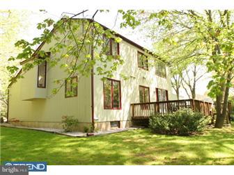 217 Terhune Road Princeton, NJ 08540 - Photo 11 of 12 a view of a big house with a big yard and large tree