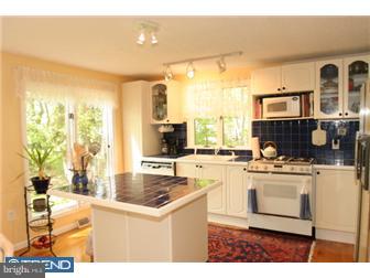217 Terhune Road Princeton, NJ 08540 - Photo 4 of 12 a kitchen with stainless steel appliances granite countertop a sink stove and refrigerator