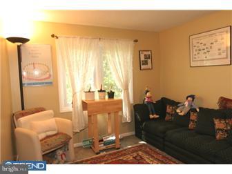 217 Terhune Road Princeton, NJ 08540 - Photo 7 of 12 a living room with furniture and a large window