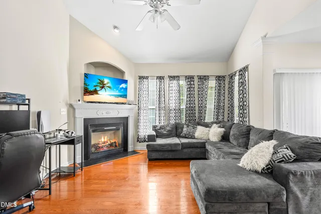 a living room with furniture and a fireplace