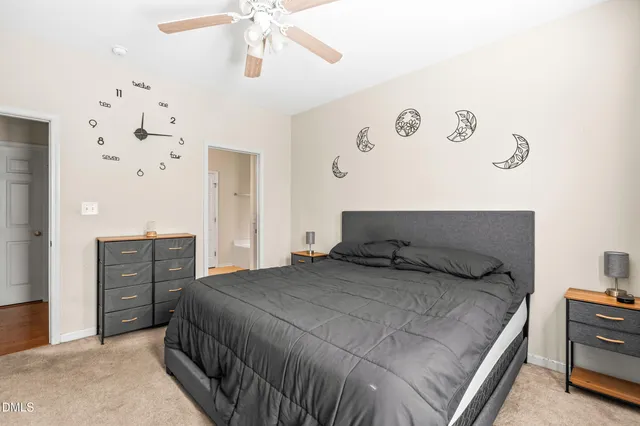 a bedroom with a bed and cabinets