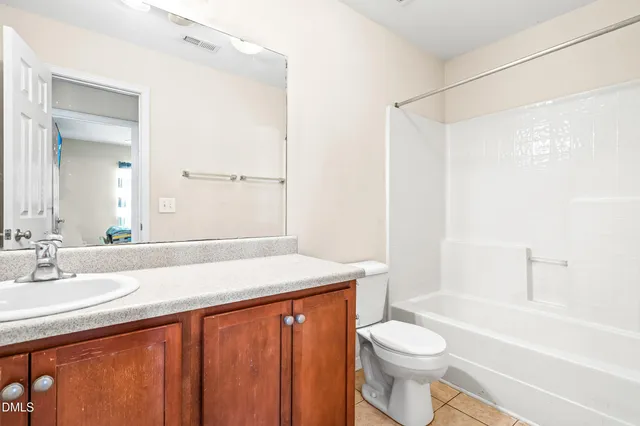 a bathroom with a sink a toilet and a bathtub