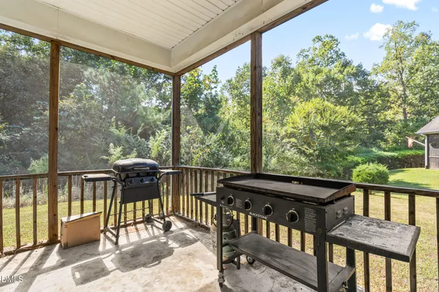 a view of a two chairs and table in the balcony