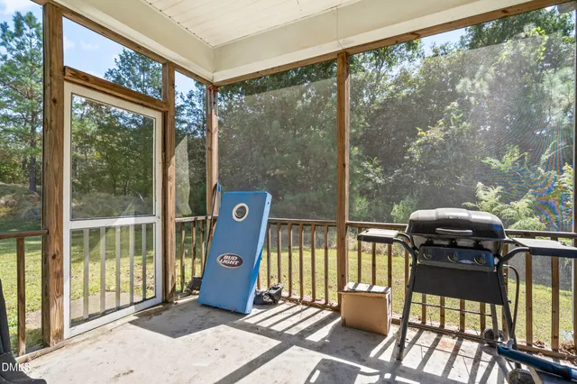 a view of a balcony with chairs