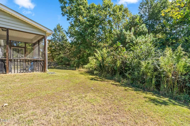 a view of a yard with an outdoor space