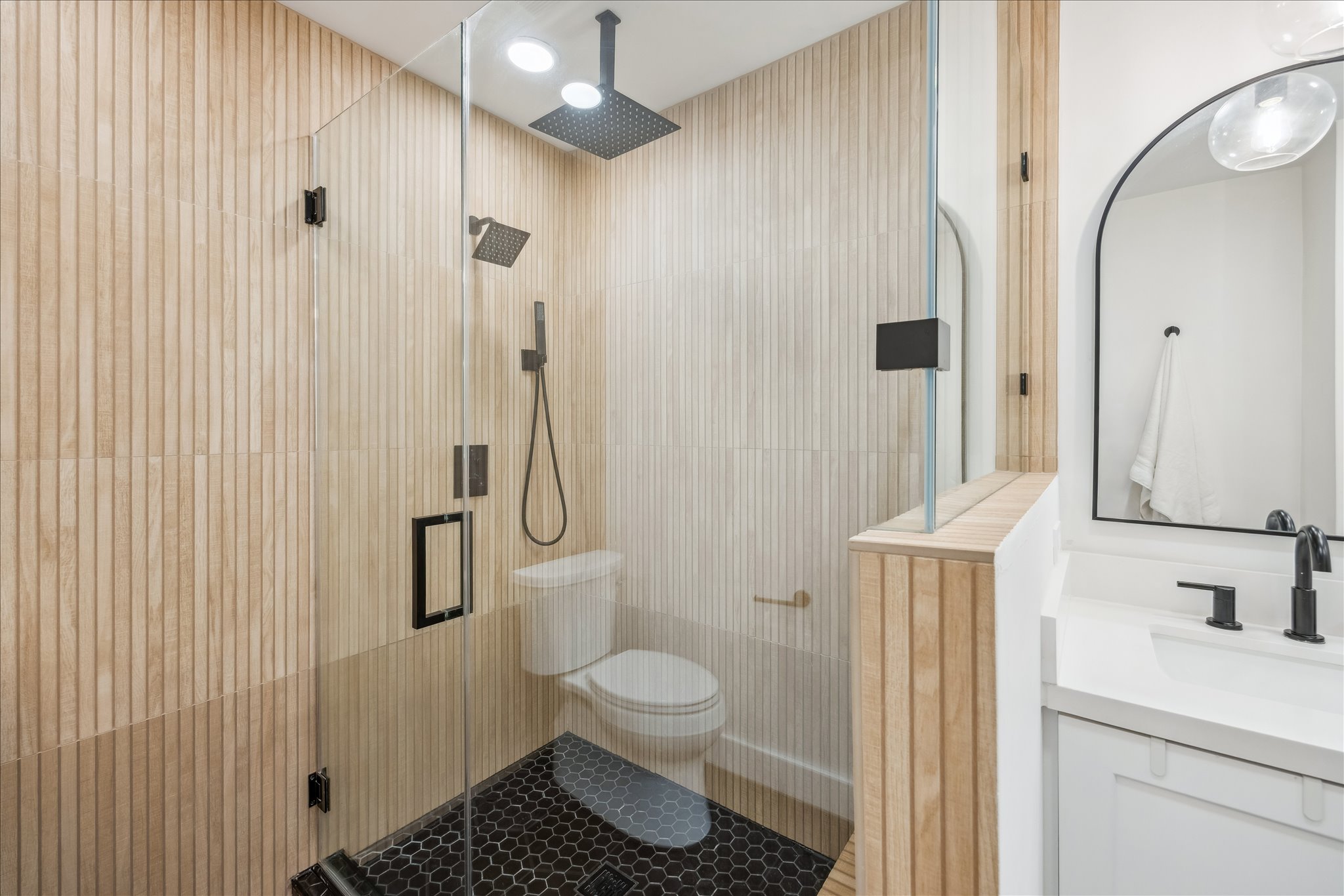 12935 Pegasus Street Austin, TX 78727 - Photo 25 of 38 Seamless shower glass and black fixtures