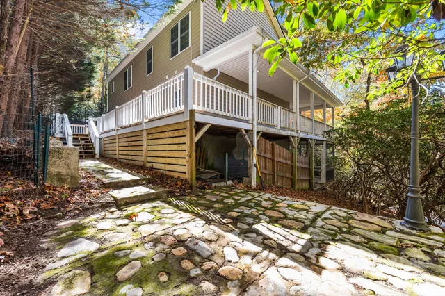 a kitchen with stainless steel appliances granite countertop a stove a refrigerator and a sink