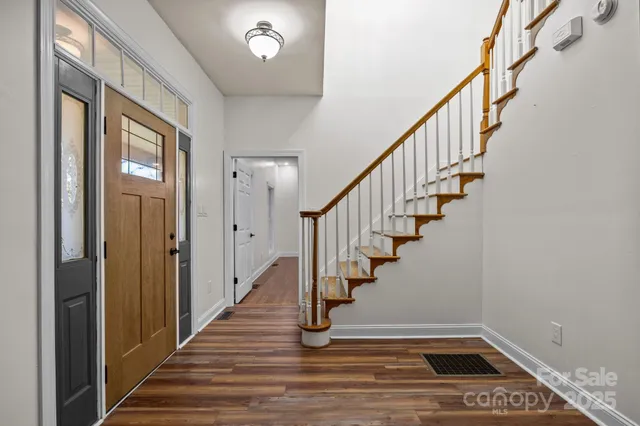 a bathroom with a bathtub and a window