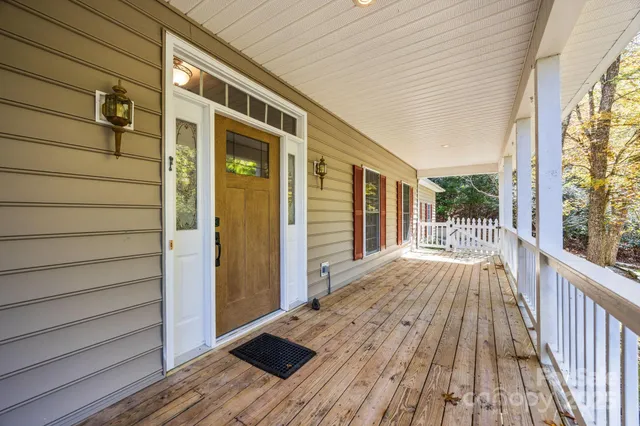 a view of backyard with deck and wooden floor