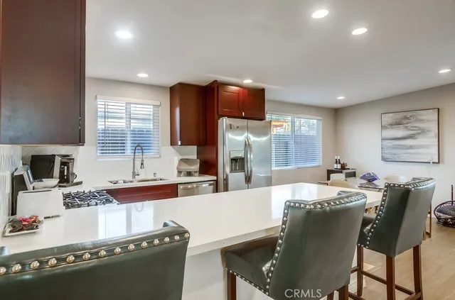 a dining table with chairs and window