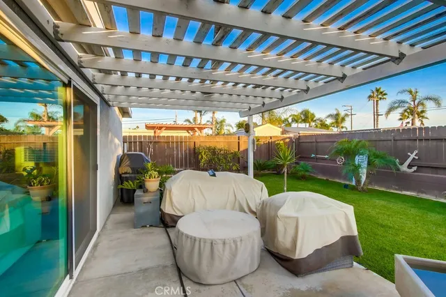 a view of a patio with a table and chairs