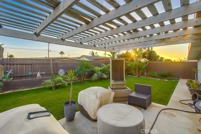 a view of yard with patio