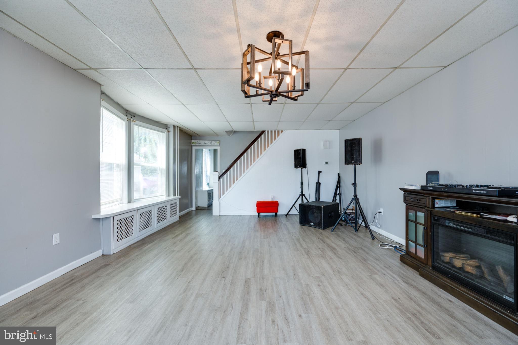 1448 Luzerne Street Reading, PA 19601 - Photo 6 of 32 Spacious room with modern lighting.