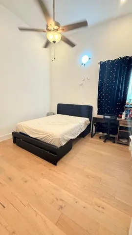 a bedroom with a bed and a cabinets