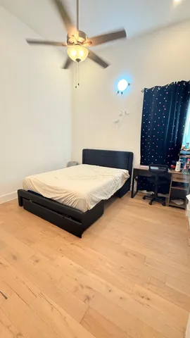 a bedroom with a bed and a cabinets