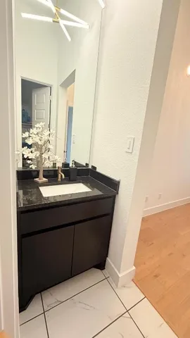 a bathroom with a sink and a mirror