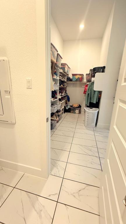 20721 Dustin Lane Pflugerville, TX 78660 - Photo 22 of 27 Spacious closet featuring light marble finish floors